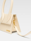 Le Chiquito Moyen Ivory BagJACQUEMUS Gorgeous brand new, 100% Authentic Jacquemus Le Chiquito Moyen Ivory Bag Model: 22E213BA002-3060-120 Color: Ivory with Gold Hardware – Reinforced handle – Magnetic flap closure – Removable long shoulder strap – Inside