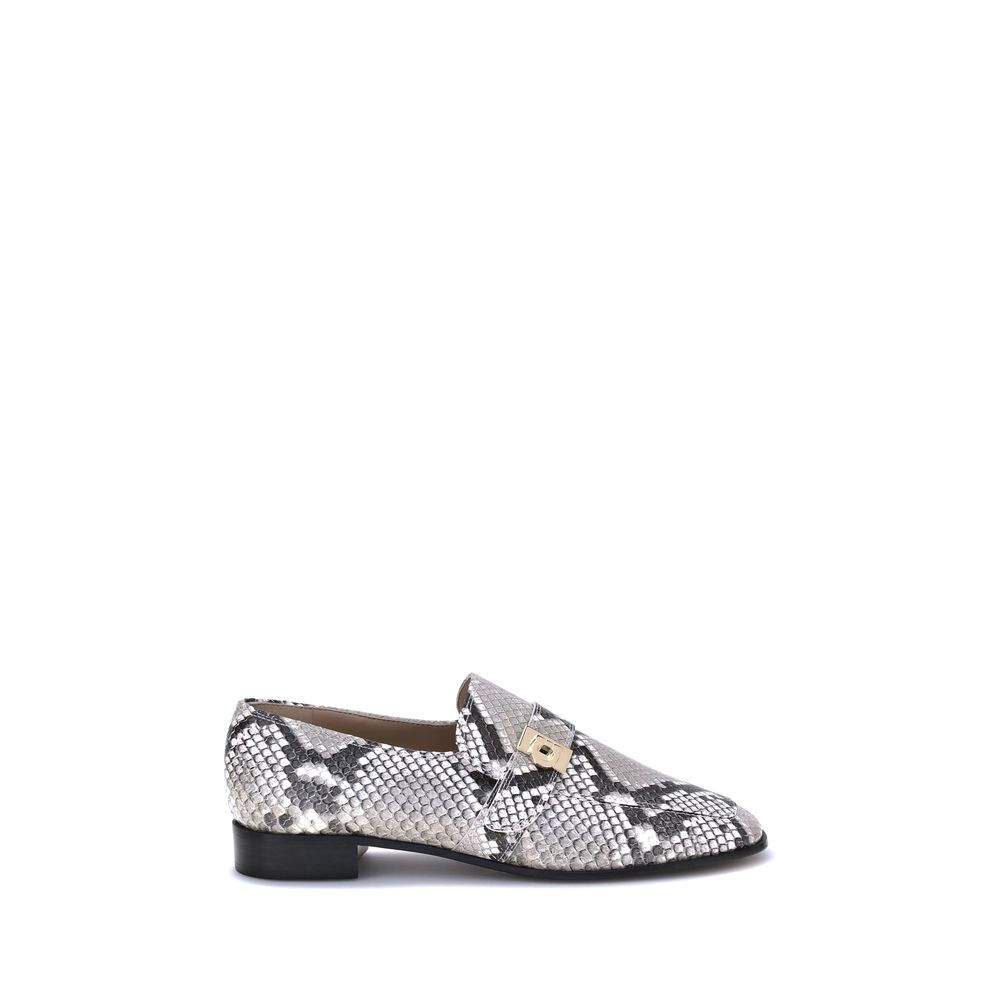 Multicolor Goatskin Slip-On LoafersFerragamo’s python print leather Loafers are an elegant expression of style and personality. Featuring a squared toe and a block heel that ensures stability and comfort, they stand out for the refined golden metal detail