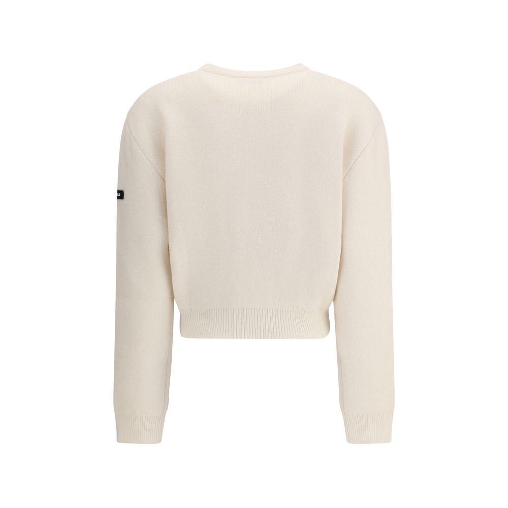 White Wool SweatshirtBalenciaga’s virgin wool Sweater is an essential piece that combines comfort and contemporary style. Made from fine virgin wool, it offers a soft and warm feel against the skin. The design includes a classic crew neck, dropped shoulde