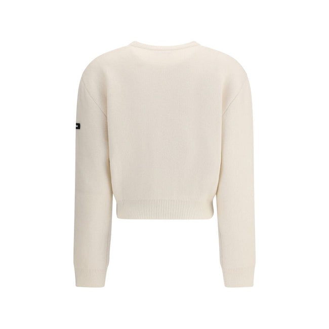 White Wool SweatshirtBalenciaga’s virgin wool Sweater is an essential piece that combines comfort and contemporary style. Made from fine virgin wool, it offers a soft and warm feel against the skin. The design includes a classic crew neck, dropped shoulde