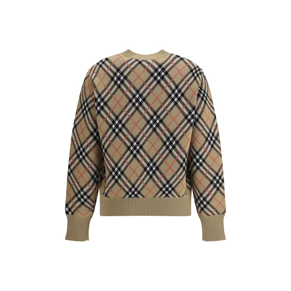 Beige Wool SweatshirtBurberry’s wool Sweater features a ribbed crew neck, cuffs and high hem also ribbed for comfort and fit. The garment features the brand’s iconic all-over Archivio Check pattern, a distinctive symbol of the brand, lending a classic and