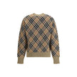 Beige Wool SweatshirtBurberry’s wool Sweater features a ribbed crew neck, cuffs and high hem also ribbed for comfort and fit. The garment features the brand’s iconic all-over Archivio Check pattern, a distinctive symbol of the brand, lending a classic and