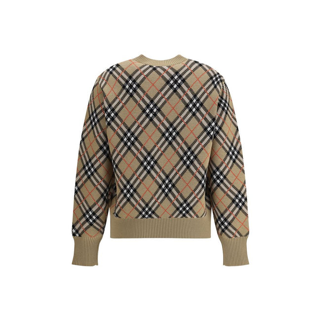 Beige Wool SweatshirtBurberry’s wool Sweater features a ribbed crew neck, cuffs and high hem also ribbed for comfort and fit. The garment features the brand’s iconic all-over Archivio Check pattern, a distinctive symbol of the brand, lending a classic and
