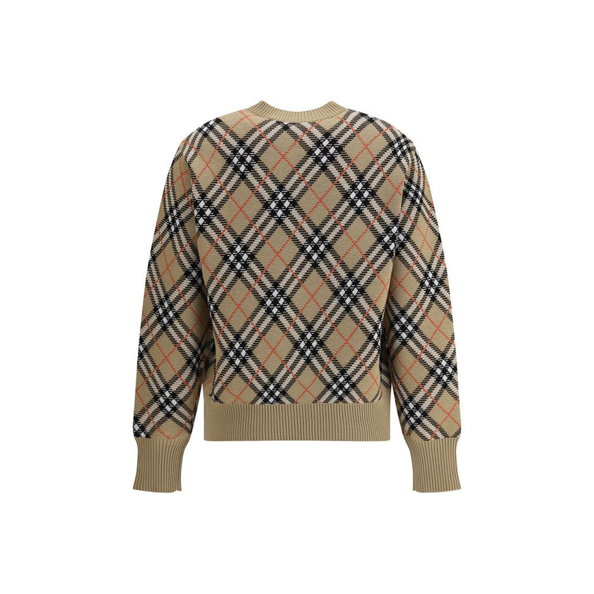 Beige Wool SweatshirtBurberry’s wool Sweater features a ribbed crew neck, cuffs and high hem also ribbed for comfort and fit. The garment features the brand’s iconic all-over Archivio Check pattern, a distinctive symbol of the brand, lending a classic and