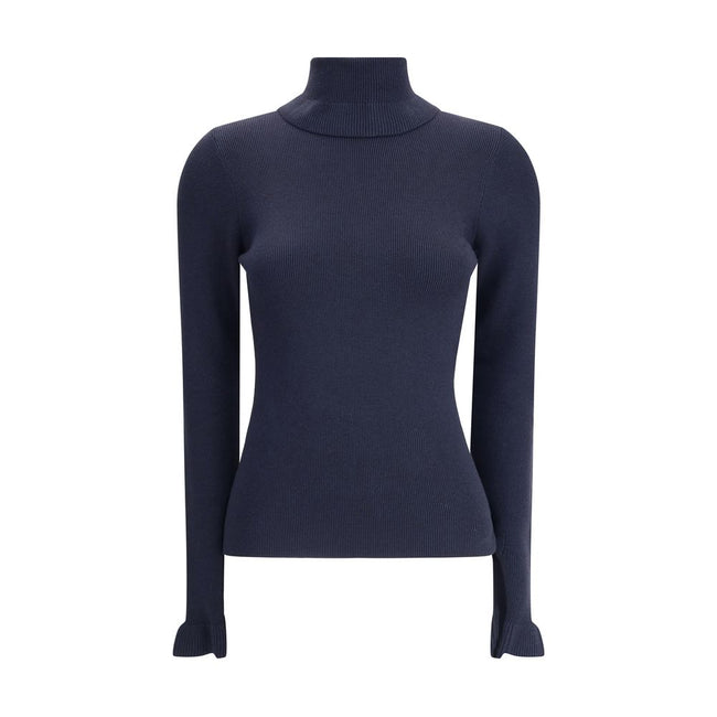 Blue Wool TurtleneckThe Chloé wool and cotton turtleneck Sweater combines elegance and comfort with a romantic touch. The ruffled details on the collar and cuffs add delicacy to the design, while the gold-tone Chloé logo plaque on the back signs the piece