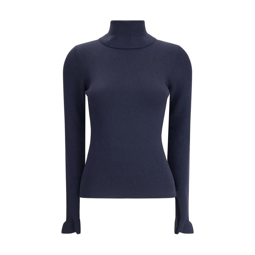 Blue Wool TurtleneckThe Chloé wool and cotton turtleneck Sweater combines elegance and comfort with a romantic touch. The ruffled details on the collar and cuffs add delicacy to the design, while the gold-tone Chloé logo plaque on the back signs the piece