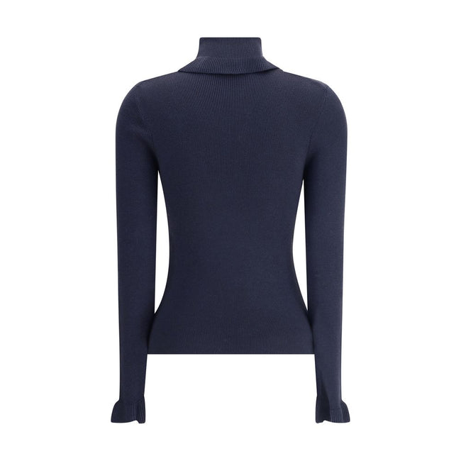 Blue Wool TurtleneckThe Chloé wool and cotton turtleneck Sweater combines elegance and comfort with a romantic touch. The ruffled details on the collar and cuffs add delicacy to the design, while the gold-tone Chloé logo plaque on the back signs the piece