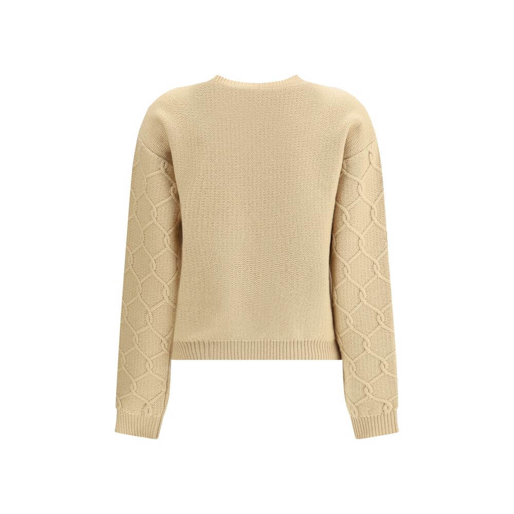 Beige Wool SweatshirtThe Etro Sweater combines comfort and sophistication with a distinctive touch. Crafted with a ribbed crew neck, hem and cuffs, it features a classic structure enhanced by floral embroidery sewn onto the front, which gives the garment