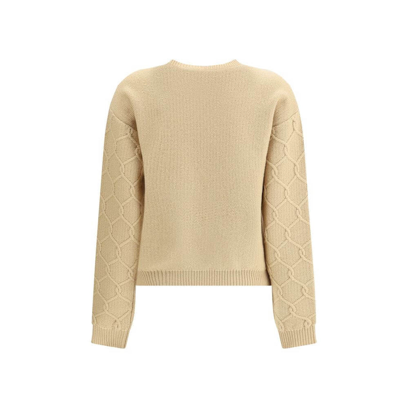 Beige Wool SweatshirtThe Etro Sweater combines comfort and sophistication with a distinctive touch. Crafted with a ribbed crew neck, hem and cuffs, it features a classic structure enhanced by floral embroidery sewn onto the front, which gives the garment