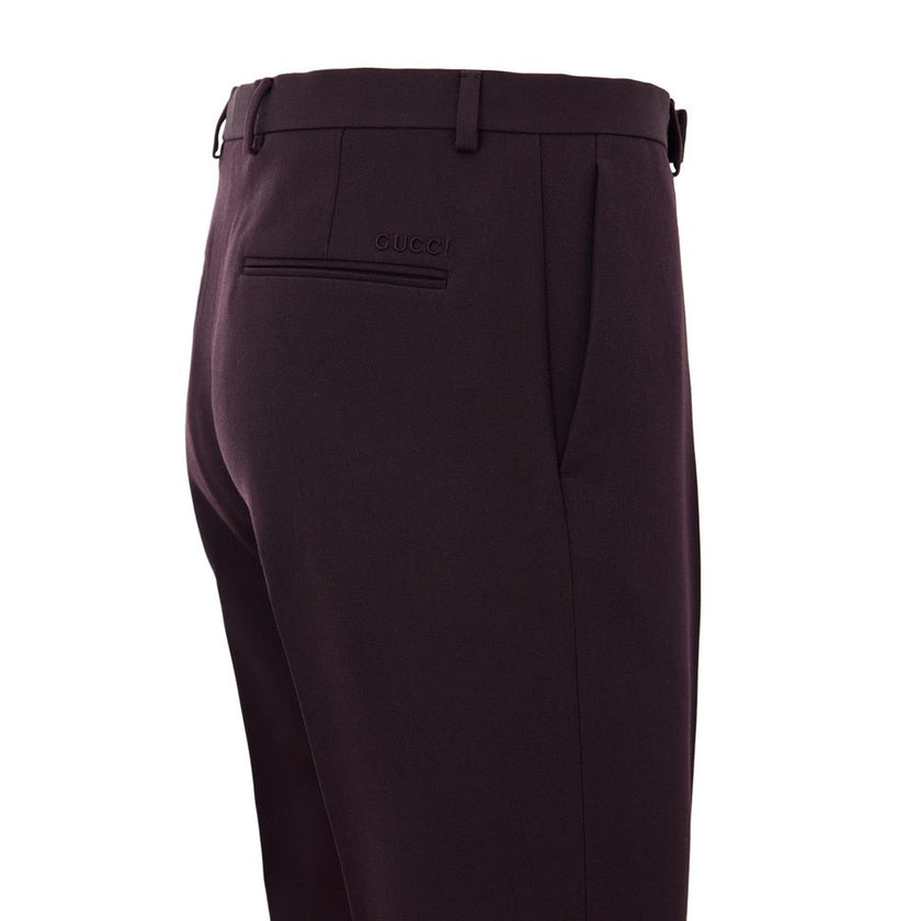 Bordeaux Wool Dress PantsBordeaux Tailored Trousers with Gucci Logo Embroidery. In dark burgundy, opening with hook and covered zip, two side welt pockets, two back pockets. Tone-on-tone embroidered logo above back pocket, straight leg. Composition: 100%