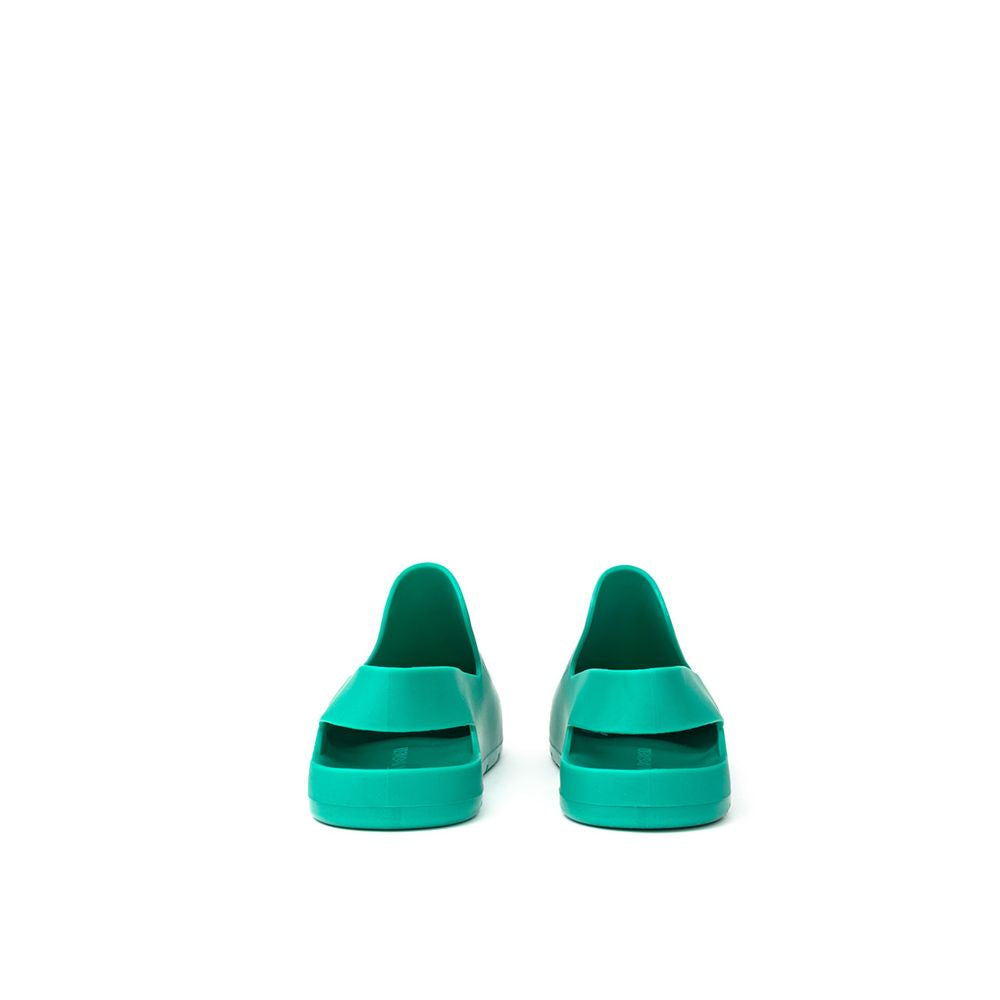 Green Cotton SlippersBottega Veneta Green Matte Rubber Puddle Slippers Sandals. Round toe, closed front and back strap, tone-on-tone engraved logo on the insole Composition: Rubber Internal SKU: 25GIU93 Brand SKU: 661269V00P03227Green Cotton Slippers${tag