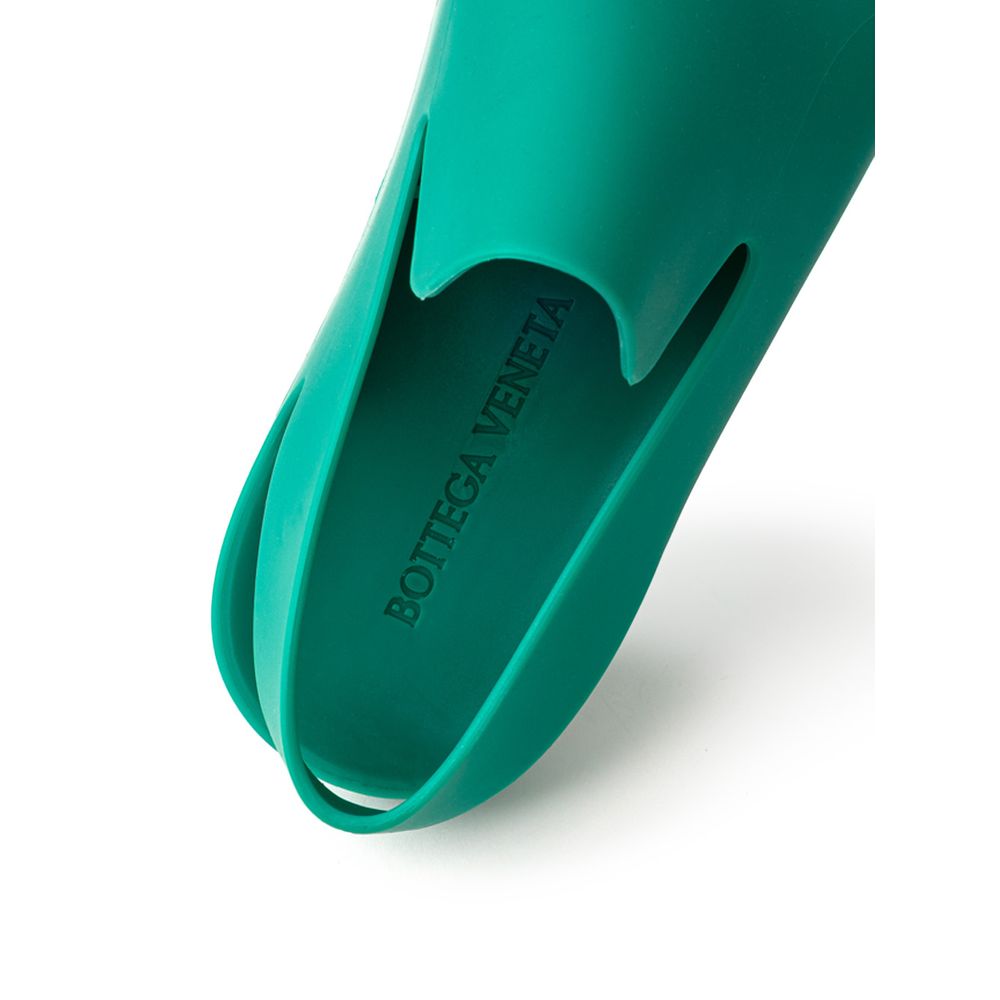 Green Cotton SlippersBottega Veneta Green Matte Rubber Puddle Slippers Sandals. Round toe, closed front and back strap, tone-on-tone engraved logo on the insole Composition: Rubber Internal SKU: 25GIU93 Brand SKU: 661269V00P03227Green Cotton Slippers${tag