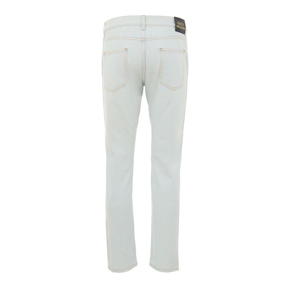 Blue Cotton Relaxed Fit JeansJeans Denim Chiaro Relaxed Fit Gucci. In light blue denim, no stretch, front opening with buttons, five pockets, on the back leather tag with gold contrasting logo. Composition: 100% Cotton Internal SKU: 25GIU172 Brand SKU: 40