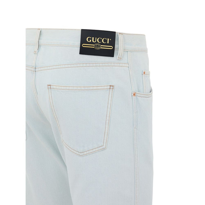 Blue Cotton Relaxed Fit JeansJeans Denim Chiaro Relaxed Fit Gucci. In light blue denim, no stretch, front opening with buttons, five pockets, on the back leather tag with gold contrasting logo. Composition: 100% Cotton Internal SKU: 25GIU172 Brand SKU: 40