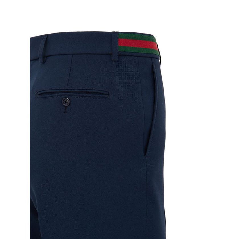 Blue Cotton Casual PantsBlue Tailored Trousers with Gucci Web Tape Detail. Opening with hook and covered zip, two side welt pockets, two back pockets closed with button, straight leg ankle length. At the waist web tape detail applied in green and red. Com