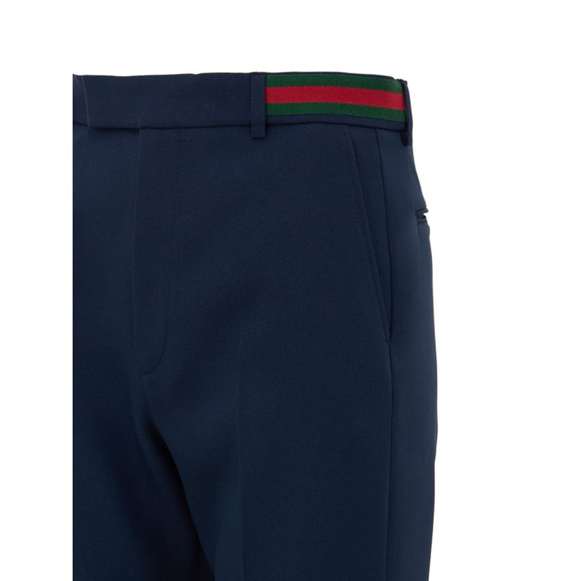 Blue Cotton Casual PantsBlue Tailored Trousers with Gucci Web Tape Detail. Opening with hook and covered zip, two side welt pockets, two back pockets closed with button, straight leg ankle length. At the waist web tape detail applied in green and red. Com