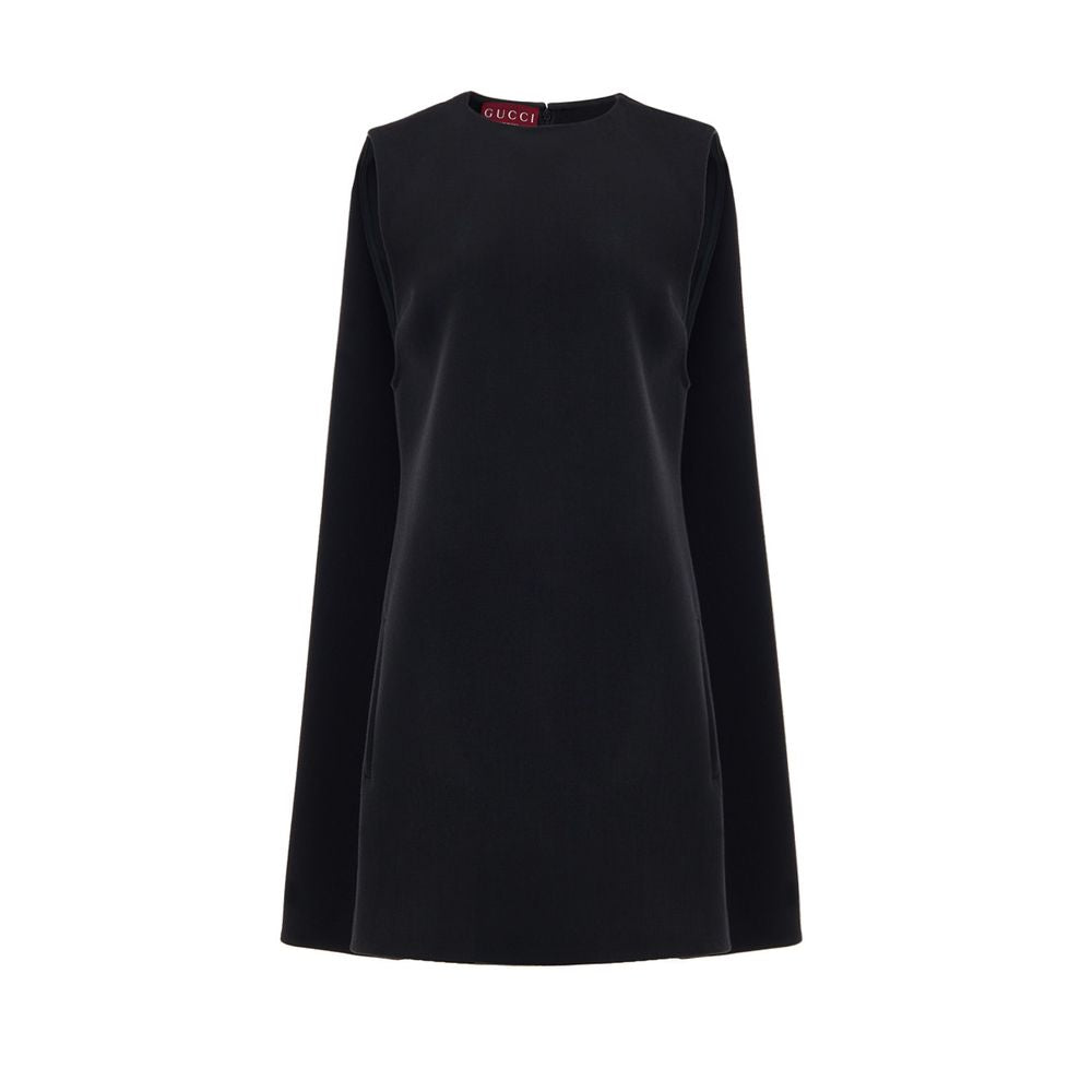 Black Wool Casual DressGucci Short Sleeveless Bell Dress. In black wool, two side welt pockets, hidden zip opening at the back. 60s-inspired model with round neckline and fabric pleat stitching on the sides. Tone-on-tone logo embroidery on the bottom. Com
