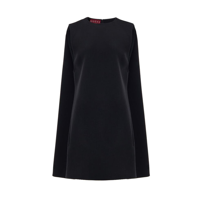 Black Wool Casual DressGucci Short Sleeveless Bell Dress. In black wool, two side welt pockets, hidden zip opening at the back. 60s-inspired model with round neckline and fabric pleat stitching on the sides. Tone-on-tone logo embroidery on the bottom. Com