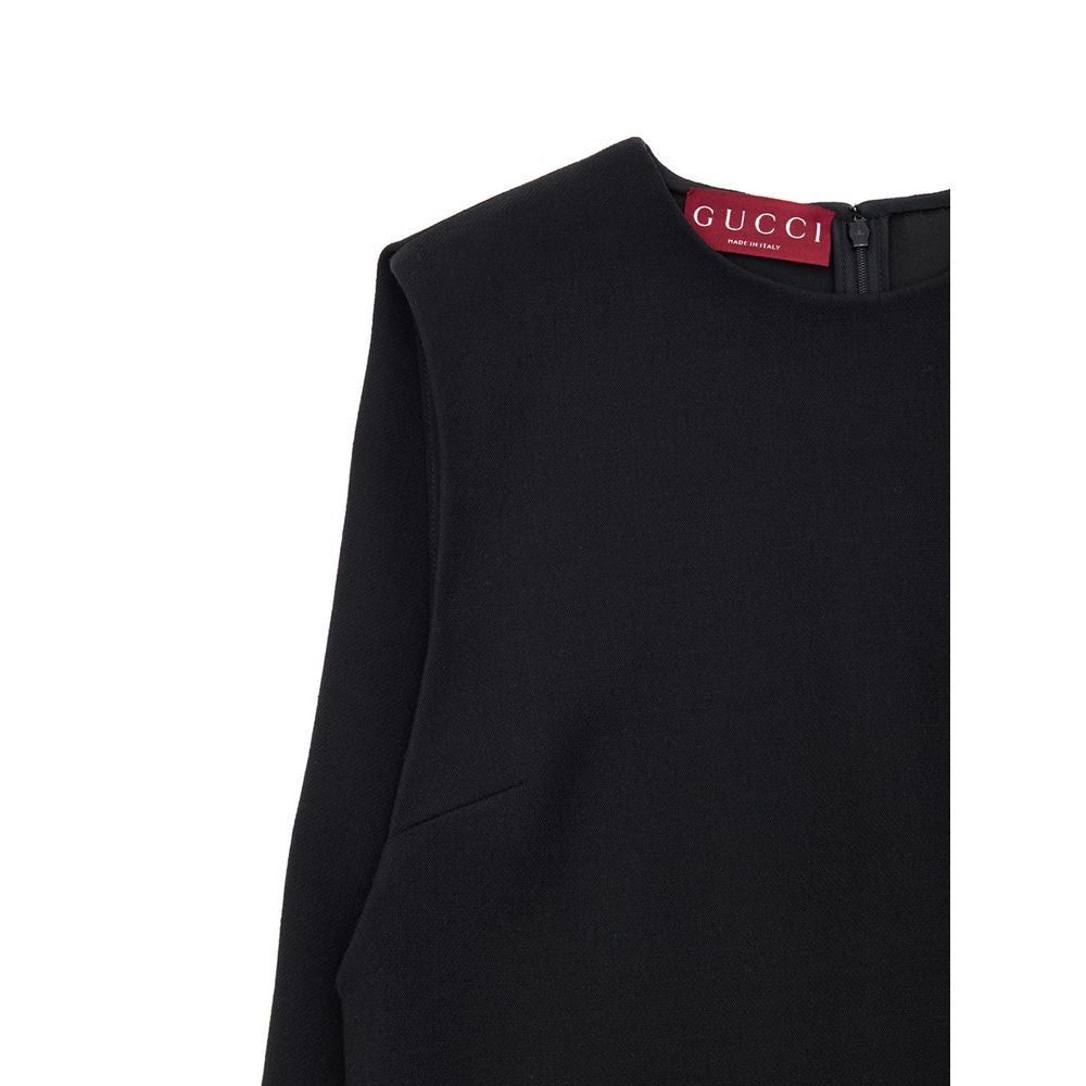 Black Wool Casual DressGucci Short Sleeveless Bell Dress. In black wool, two side welt pockets, hidden zip opening at the back. 60s-inspired model with round neckline and fabric pleat stitching on the sides. Tone-on-tone logo embroidery on the bottom. Com