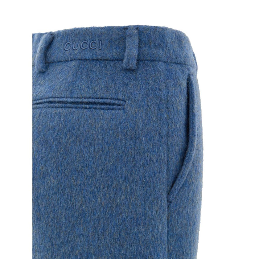 Blue Wool ShortsShorts Mixed Mohair Shorts in Blue Avio Gucci. Opening on the side with hidden zip and metal hook with logo, two side welt pockets, two back pockets, embroidered logo on the back. Inner lining Composition: 50% Wool, 28% Mohair, 22% Polyami