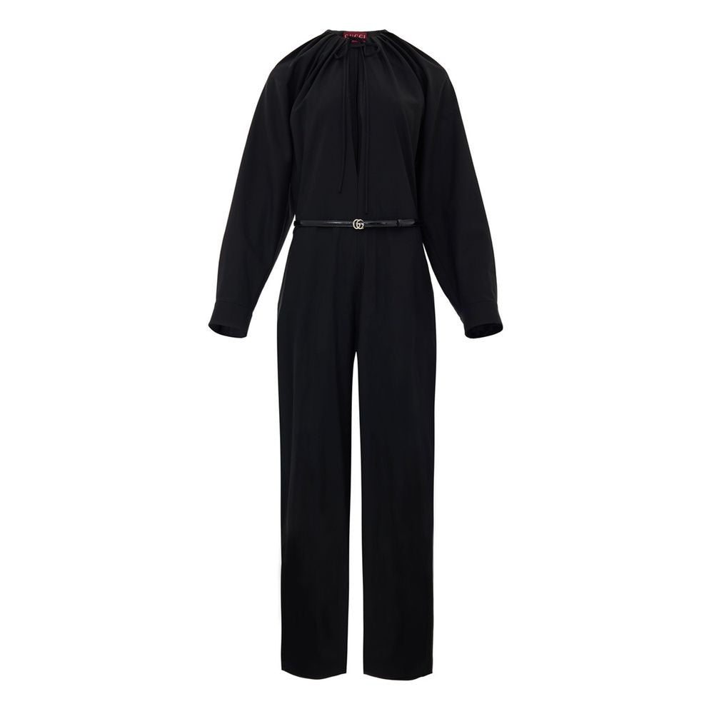 Black Wool JumpsuitBlack Tracksuit Dress with Gucci Belt. Crewneck, wide neckline adjustable with lace, long sleeves closed with button. Removable thin patent leather belt with GG logo at the waist. Wide leg. Composition: 96% Wool, 4% Elastane Internal SK
