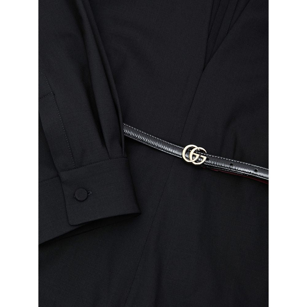 Black Wool JumpsuitBlack Tracksuit Dress with Gucci Belt. Crewneck, wide neckline adjustable with lace, long sleeves closed with button. Removable thin patent leather belt with GG logo at the waist. Wide leg. Composition: 96% Wool, 4% Elastane Internal SK