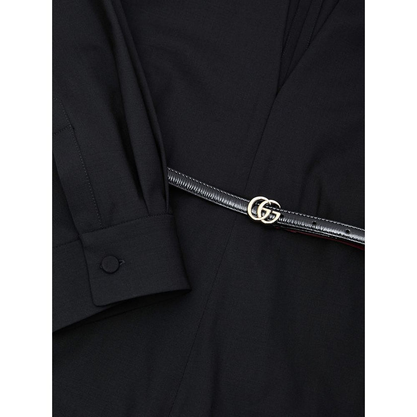 Black Wool JumpsuitBlack Tracksuit Dress with Gucci Belt. Crewneck, wide neckline adjustable with lace, long sleeves closed with button. Removable thin patent leather belt with GG logo at the waist. Wide leg. Composition: 96% Wool, 4% Elastane Internal SK