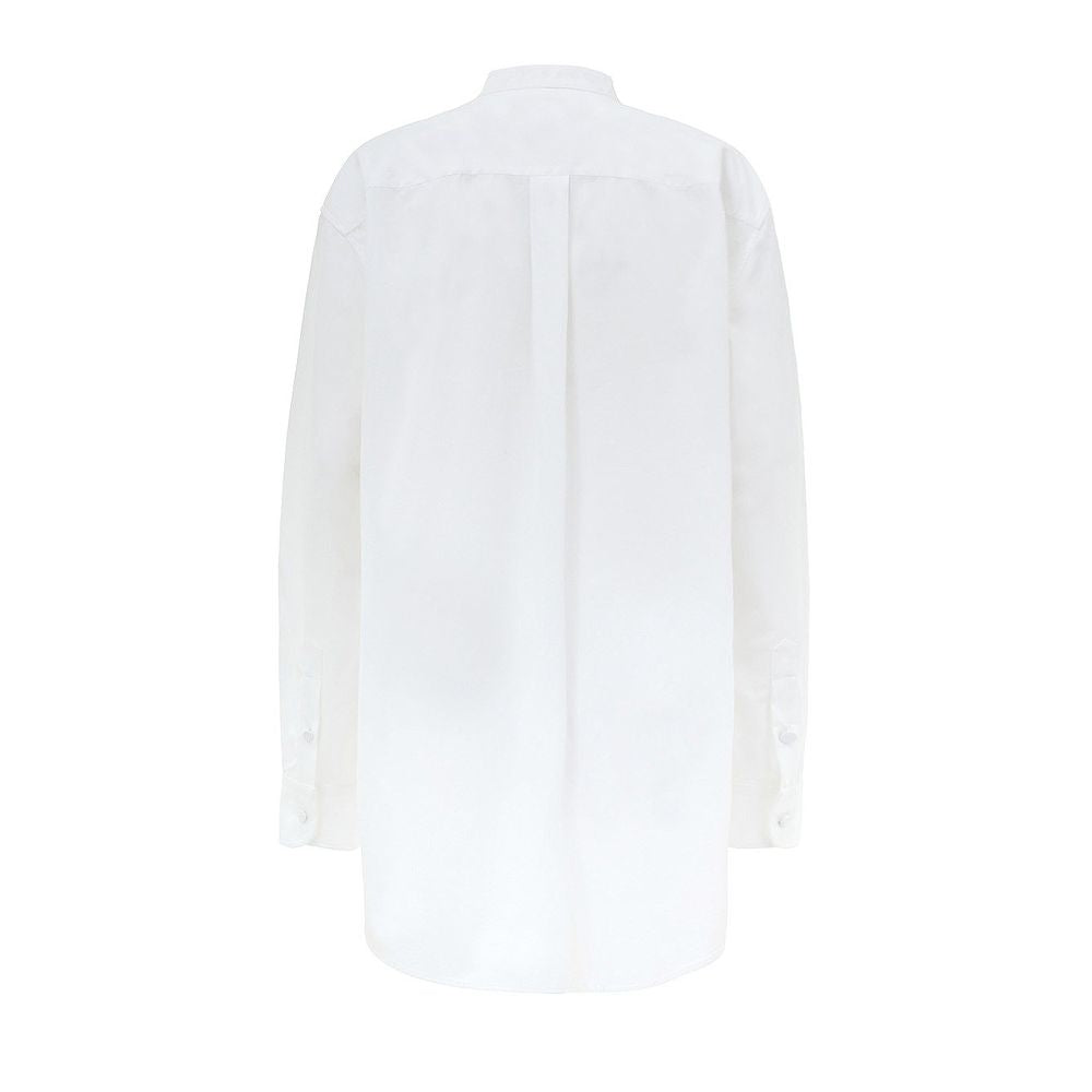 White Cotton BlouseWhite Cotton Poplin Blouse with Gucci Crystal Decorations. Front fastening with tone-on-tone fabric-covered buttons, round neckline, piqué panel, edge with crystal and bead details, rounded at the bottom Composition: 100% Cotton Interna