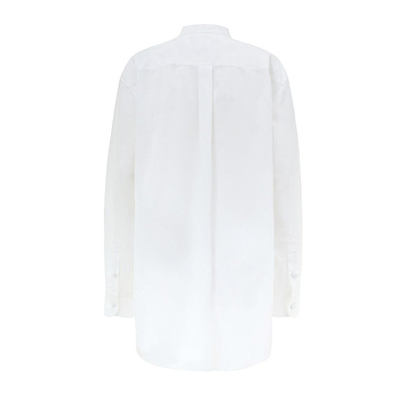 White Cotton BlouseWhite Cotton Poplin Blouse with Gucci Crystal Decorations. Front fastening with tone-on-tone fabric-covered buttons, round neckline, piqué panel, edge with crystal and bead details, rounded at the bottom Composition: 100% Cotton Interna