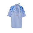 Blue Cotton Pattern ShirtLight Blue Cotton Poplin Kimono Shirt with Gucci Flower Print. Deep V-neckline with bow, iconic metal and leather horsebit applied on the front, two side welt pockets, rounded on the front and squared on the back. Contrasting flow