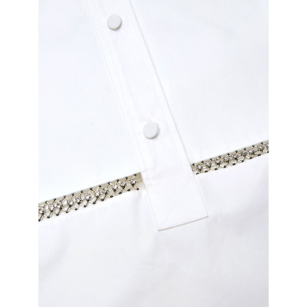 White Cotton BlouseWhite Cotton Poplin Blouse with Gucci Crystal Decorations. Front fastening with tone-on-tone fabric-covered buttons, round neckline, piqué panel, edge with crystal and bead details, rounded at the bottom Composition: 100% Cotton Interna