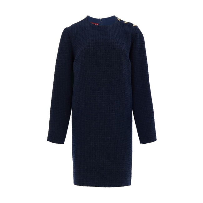 Navy Blue Wool Short DressBlue Bouclé Dress with Gucci Logo Buttons. Mid-length dress, round neckline, long sleeves, two side welt pockets, opening on the shoulder with gold Gucci logo buttons. Straight tube line, internal lining Composition: 84% Wool 16%