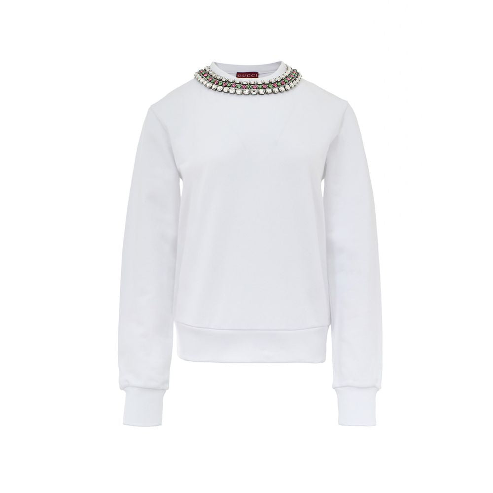 White Cotton SweatshirtWhite Sweatshirt with Jewel Neck Gucci. Round neckline, long sleeves, opening on the shoulder with hidden zip. Jewel neck detail with crystals applied as a necklace Composition: 100% Cotton Internal SKU: 25GIU208 Brand SKU: 791337XJ