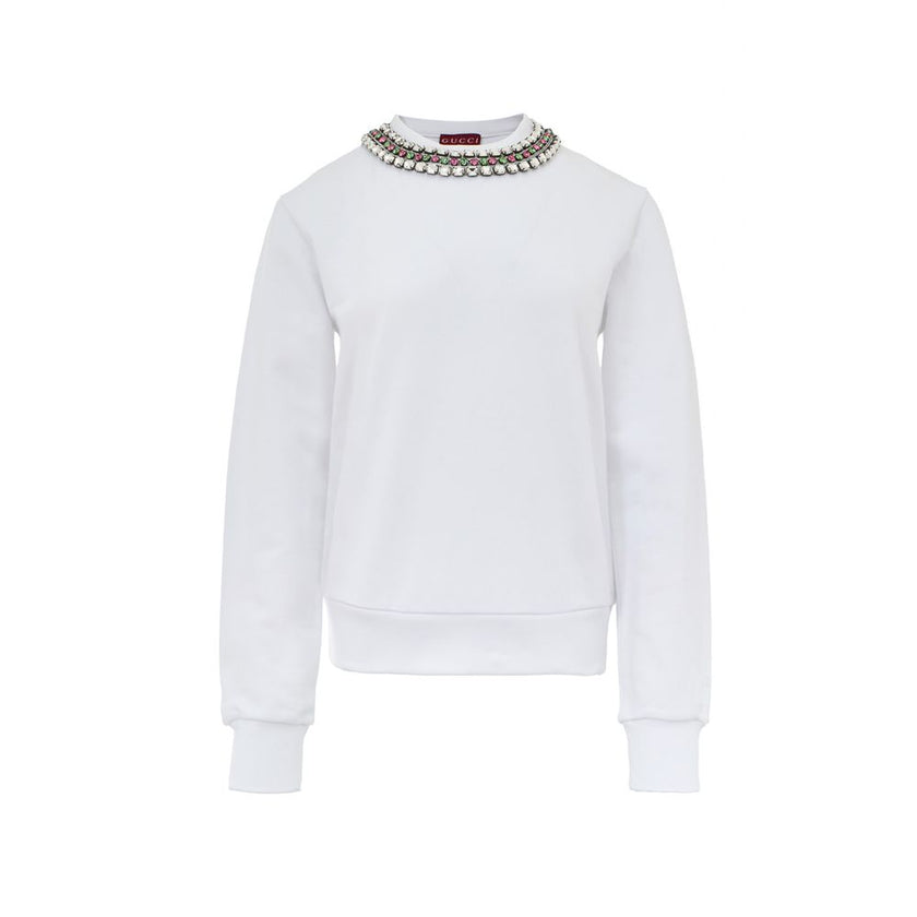 White Cotton SweatshirtWhite Sweatshirt with Jewel Neck Gucci. Round neckline, long sleeves, opening on the shoulder with hidden zip. Jewel neck detail with crystals applied as a necklace Composition: 100% Cotton Internal SKU: 25GIU208 Brand SKU: 791337XJ