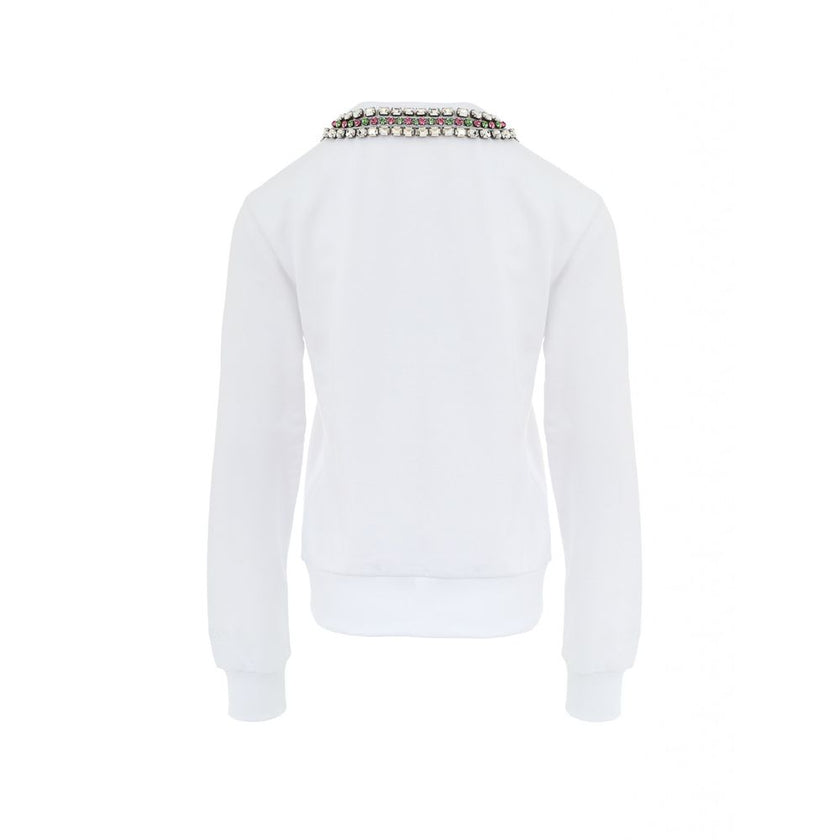 White Cotton SweatshirtWhite Sweatshirt with Jewel Neck Gucci. Round neckline, long sleeves, opening on the shoulder with hidden zip. Jewel neck detail with crystals applied as a necklace Composition: 100% Cotton Internal SKU: 25GIU208 Brand SKU: 791337XJ