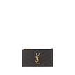 Card HolderCalfskin Card Holder by Saint Laurent, zipper closure on top, contrasting iconic YSL logo plaque on front, card slot on back. Season: AW25 Dimension: 13×13 Composition: GENERAL 100% Calf Leather Bos Taurus MADE IN ITALYCard Holder${tagsSaint La