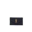 Black Calf Leather Bos Taurus WalletLeather Card Holder by Saint Laurent is a compact and sophisticated accessory designed for those seeking style and functionality in one. The front snap-button closure provides practicality and security, while the embroi