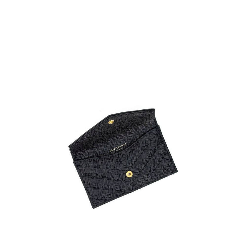 Black Calf Leather Bos Taurus WalletLeather Card Holder by Saint Laurent is a compact and sophisticated accessory designed for those seeking style and functionality in one. The front snap-button closure provides practicality and security, while the embroi