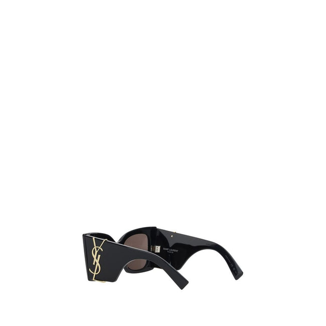 Black Acetate SunglassesSaint Laurent’s M119 Sunglasses are the epitome of bold elegance. With an oversized square design, they feature a maxi plaque with the iconic three-dimensional gold-plated YSL logo applied to the side panels, adding a touch of luxu