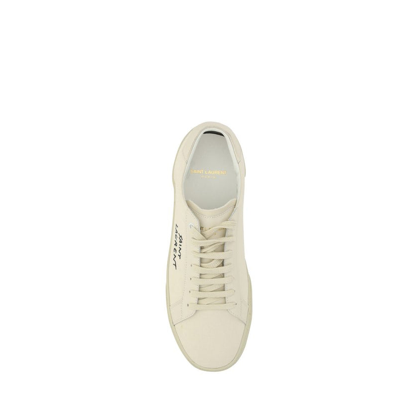 White Rubber Low Top SneakersCotton Sneakers by Saint Laurent, round toe, lace-up front closure, crater-effect flat sole, iconic brand signature embroidered in contrast on outer side panel. Season: AW25 Composition: SOLE 100% Rubber UPPER 100% Cotton MADE