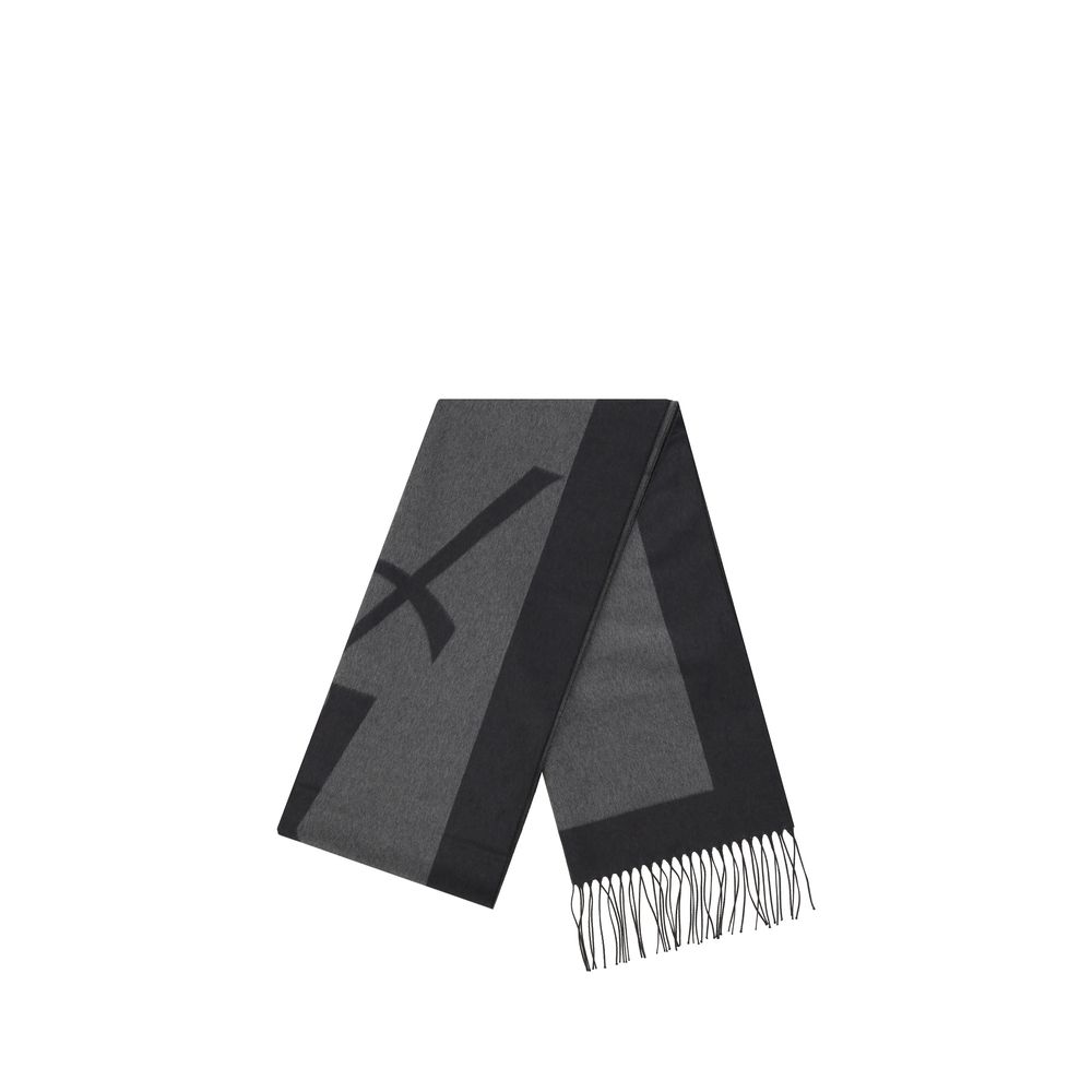 Gray Silk ScarfSaint Laurent’s Cassandre Scarf is made of pure silk and embellished with the iconic contrasting YSL logo. Featuring frayed hems, it has an elongated and elegant format (50 x 215 cm), ideal for adding a distinctive touch to any look. Season