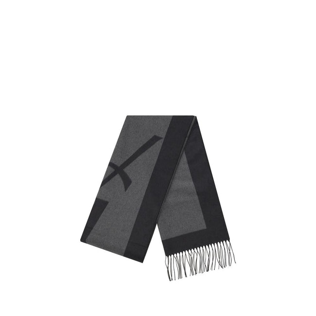 Gray Silk ScarfSaint Laurent’s Cassandre Scarf is made of pure silk and embellished with the iconic contrasting YSL logo. Featuring frayed hems, it has an elongated and elegant format (50 x 215 cm), ideal for adding a distinctive touch to any look. Season