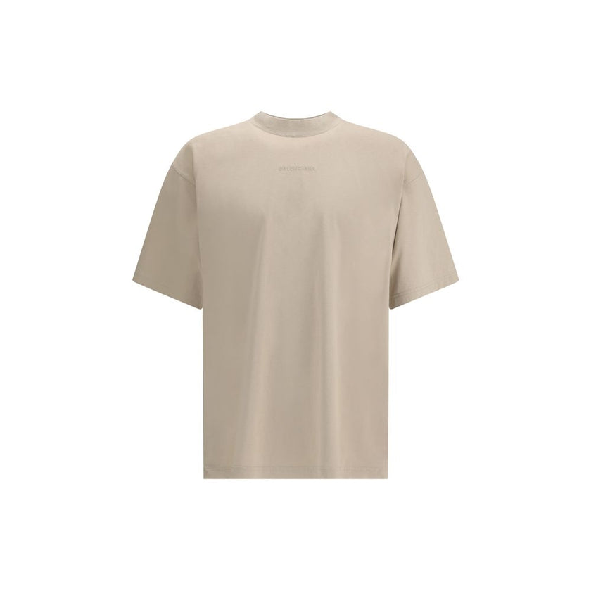Logoed T-ShirtBalenciaga’s Logo T-Shirt features a ribbed crew neck with a distressed effect, adding a worn-in touch to the design. The iconic tone-on-tone stitched logo on the front completes the garment with understated elegance. Season: AW25 Fit: Overs