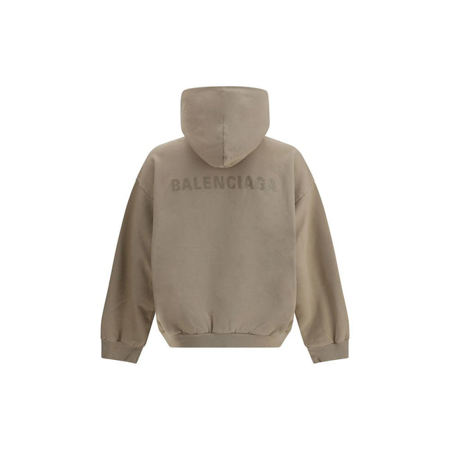 Beige Cotton SweatshirtCotton Hoodie by Balenciaga features a patch pouch pocket on the front and the iconic tone-on-tone embroidered monogram, lending a touch of understated sophistication. Ribbed cuffs and hem ensure a snug and comfortable fit. The vint