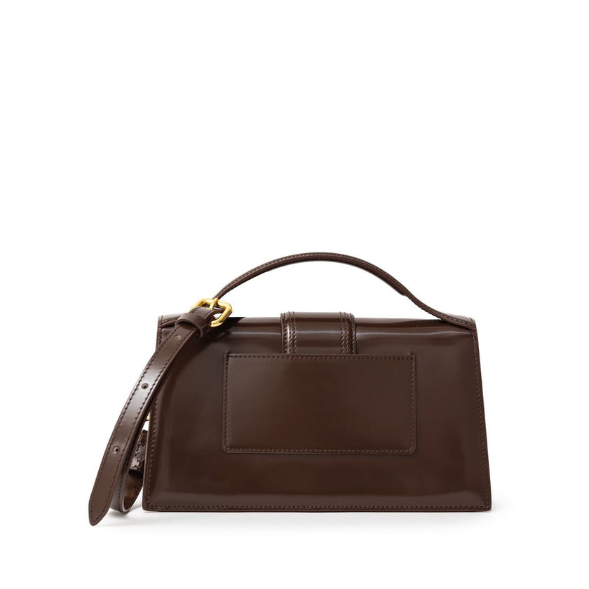 Brown Leather Le Grand Bambino HandbagJACQUEMUS Gorgeous brand new, 100% Authentic Jacquemus Le Grand Bambino light brown Bag. Model: 233BA007-3128 Color: Midnight Brown with Gold Hardware Material: Leather – Adjustable shoulder strap – Small handle – Rem