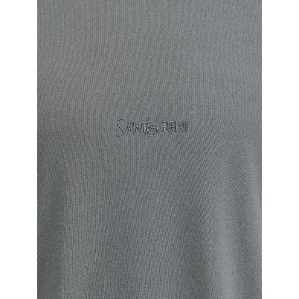 Green Cotton T-ShirtSaint Laurent’s cotton T-shirt is an essential and refined piece with a minimalist design. The ribbed crew neck ensures comfort, while the brand’s iconic tone-on-tone embroidered logo on the front adds a discreet yet distinctive touch