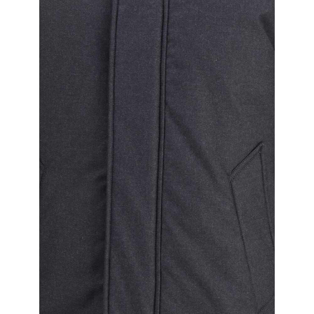 Black Fleece Wool ParkaWoolrich virgin wool Down parka Jacket with high collar and adjustable drawstring hood, ideal for facing the coldest days in style. The front closure is finished with a flap and buttons, while two side welt pockets add functionality