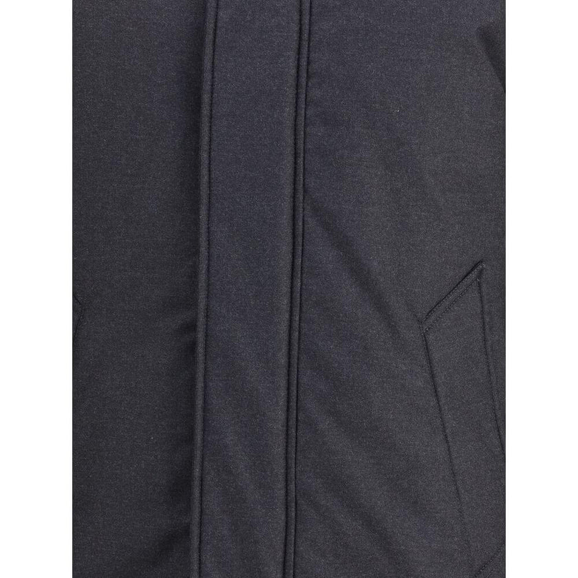 Black Fleece Wool ParkaWoolrich virgin wool Down parka Jacket with high collar and adjustable drawstring hood, ideal for facing the coldest days in style. The front closure is finished with a flap and buttons, while two side welt pockets add functionality