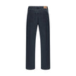 Black Cotton Straight-Leg JeansCotton Jeans by Prada, made in the classic 5-pocket model with front button closure. The essential design is enriched by an applied logo patch on the back, a distinctive detail that recalls the brand’s iconic aesthetic. Seas