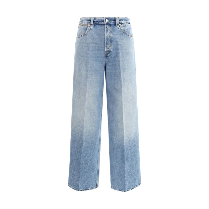 Light Blue Cotton Jeans DenimGucci’s wide leg Jeans feature a faded effect and light wash that give a vintage yet modern allure. With a high waist and belt loops, they offer a comfortable and defined fit. The button and zipper closure ensures practicality